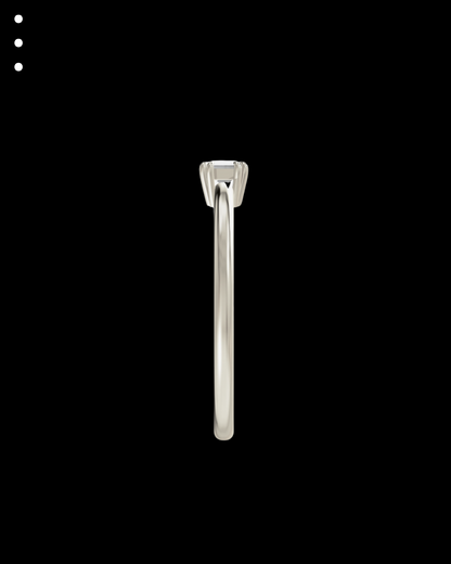 Silver nose ring with a square gemstone on a black background