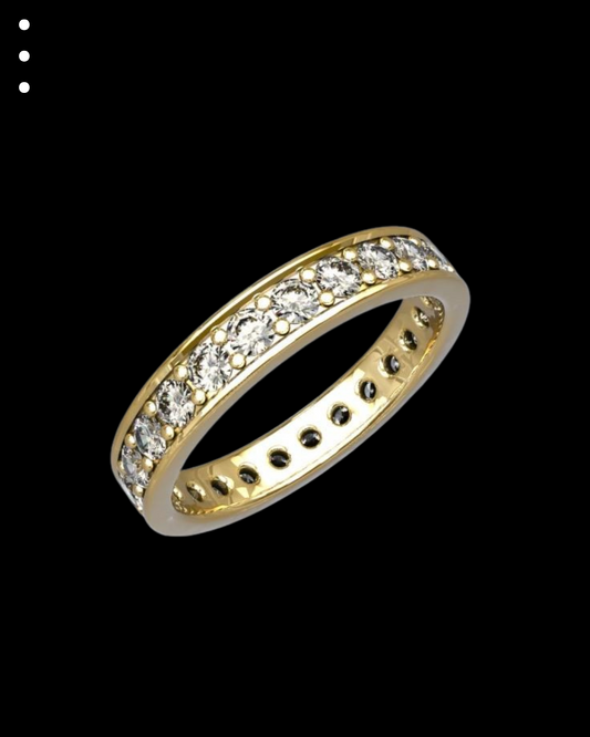 Gold ring with embedded diamonds on a black background